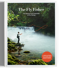 Load image into Gallery viewer, The cover of the book 'The Fly Fisher' featuring an updated edition badge, an image of a person fly fishing in a scenic location with a waterfall in the background, and lush greenery.