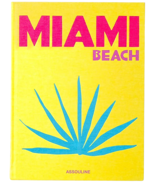 A book cover for 'Miami Beach' with a yellow background and a graphic of a palm tree. The text on the cover is in blue and red, indicating the title 'MIAMI BEACH' in large letters along with the Assouline brand name at the bottom.