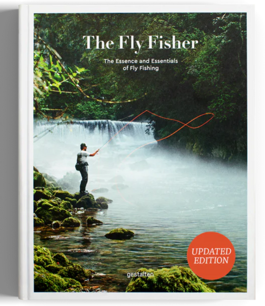 The cover of the book 'The Fly Fisher' featuring an updated edition badge, an image of a person fly fishing in a scenic location with a waterfall in the background, and lush greenery.